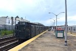 Arnine and an R179 set sitting across from each other at Rockaway Park Station 